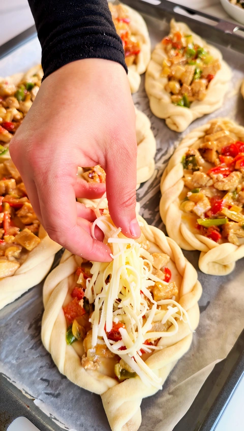 Shaping stuffed bread rolls before baking