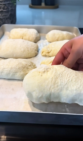 Easy no-knead bread recipe showing soft, fluffy bread pieces fresh out of the oven.