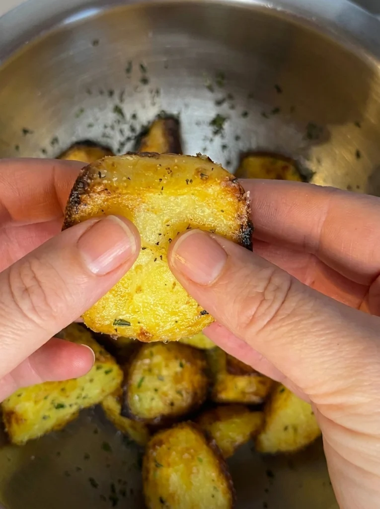 Best roast potatoes recipe with crispy texture and fluffy center ready to serve