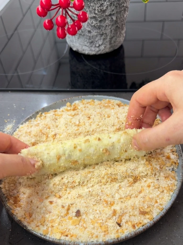 Yufka rolls dipped in egg mixture and coated with breadcrumbs before baking
