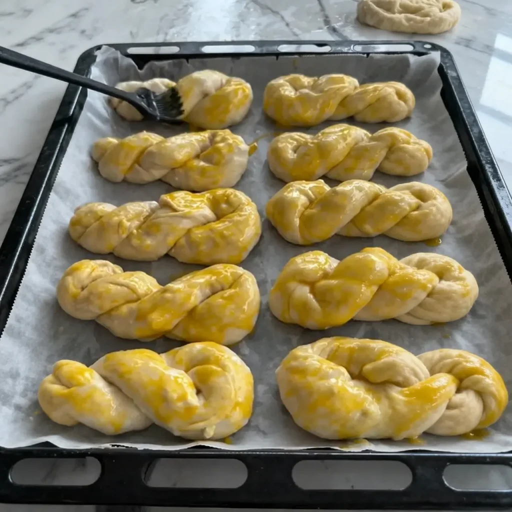 Cheese layered pastry brushed with egg yolk before baking