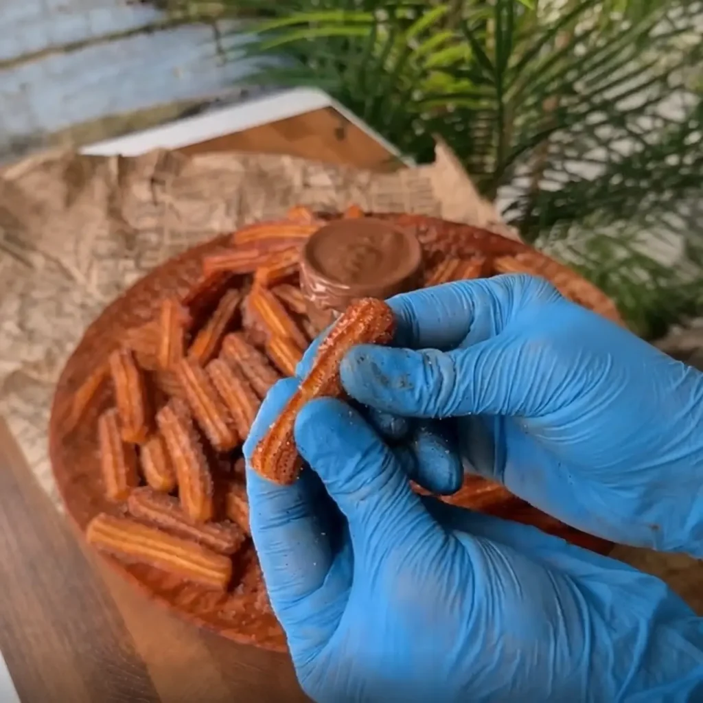 ALT: Homemade churros served with chocolate dipping sauce