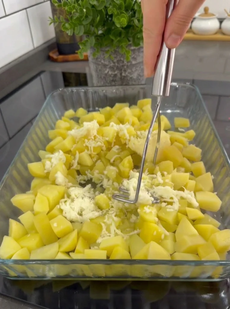 Creamy mashed potatoes spread evenly in a baking dish
