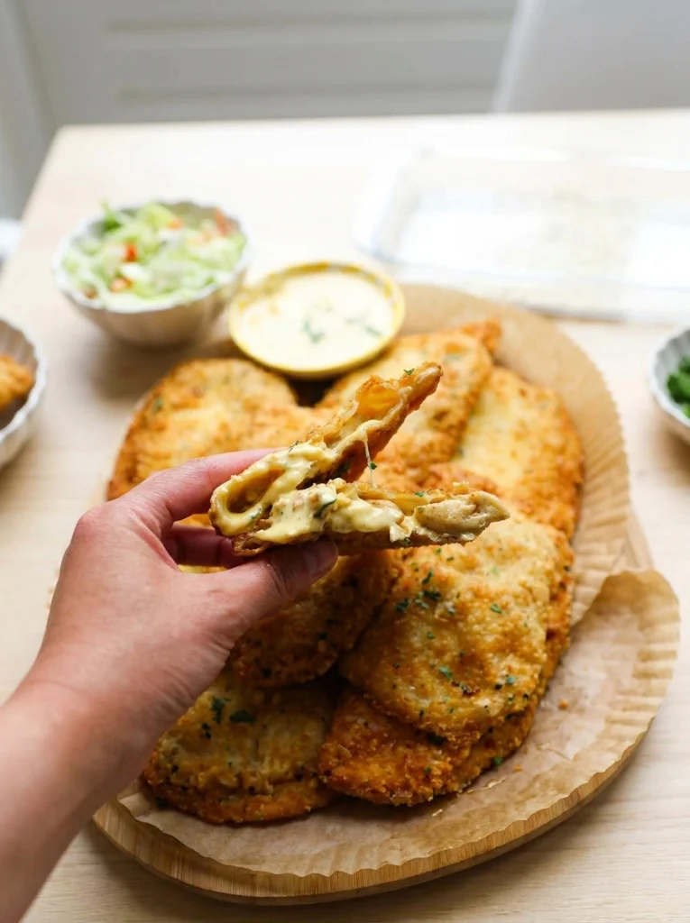 Sliced crispy chicken Caesar flatbread served warm