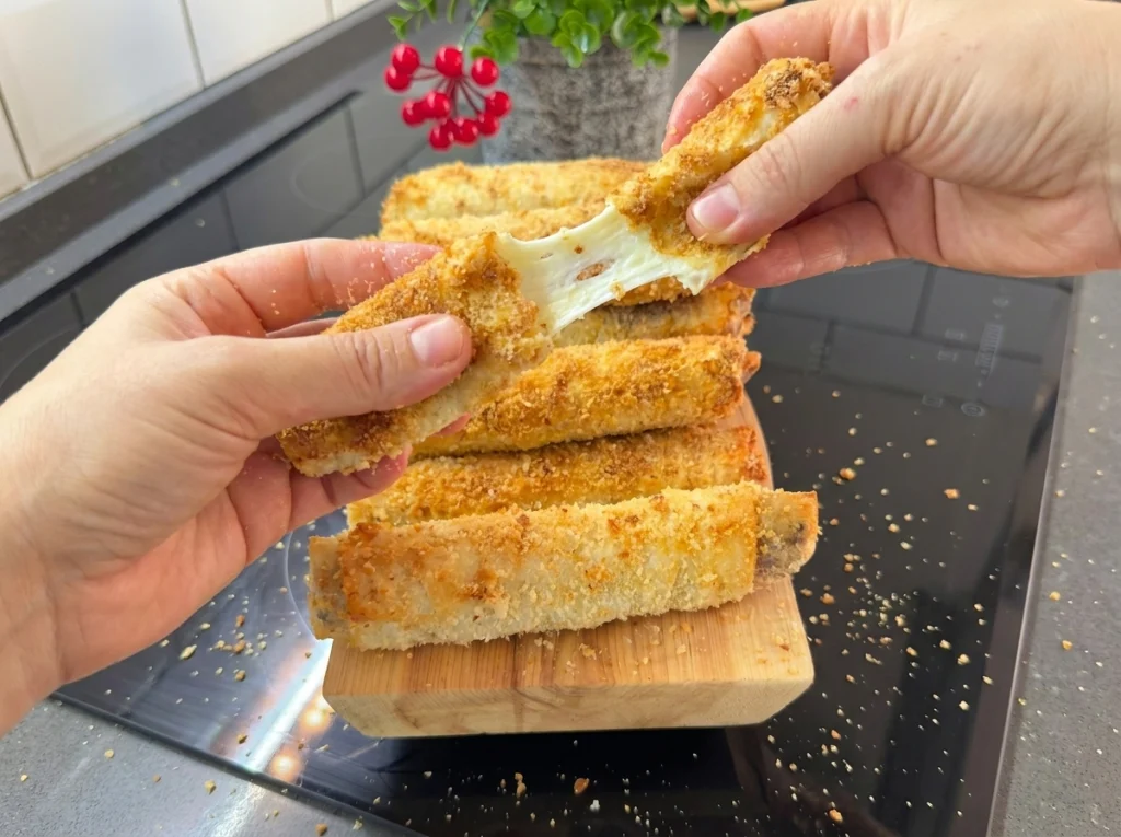 Crispy baked yufka pastry rolls filled with minced meat and cheddar cheese
