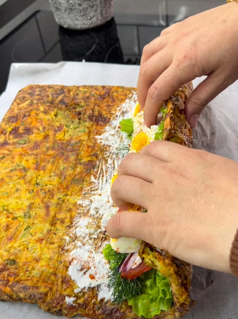 Sliced flourless vegetable lavash wrap showing the filling