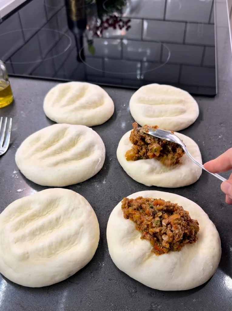 Seasoned minced meat and vegetable filling cooking in a pan