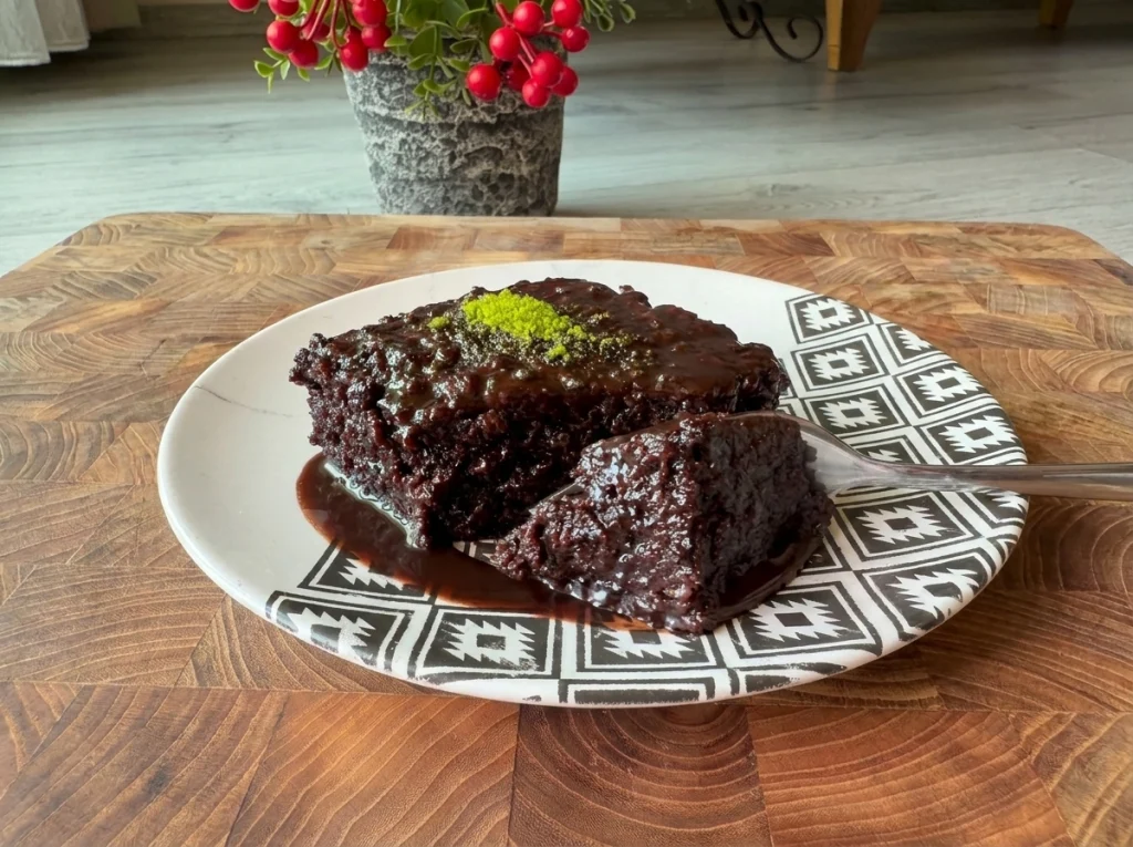 Moist chocolate cake recipe topped with rich chocolate sauce