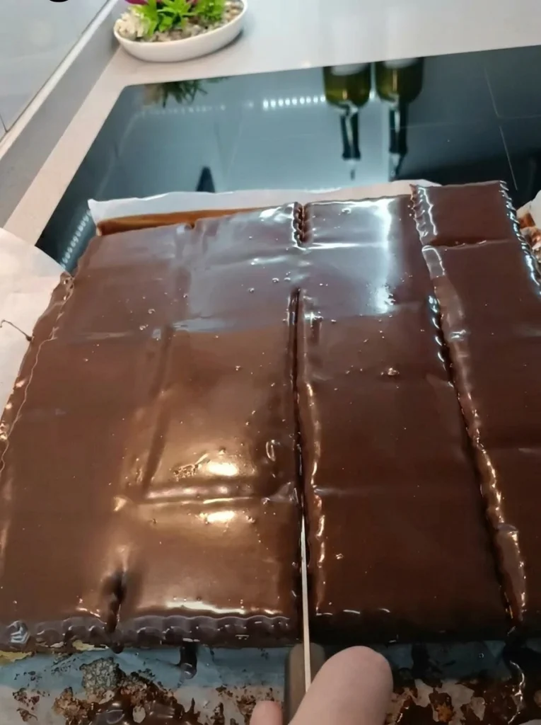 Close-up slice of Mosaic Cake showing layered biscuit and ganache texture