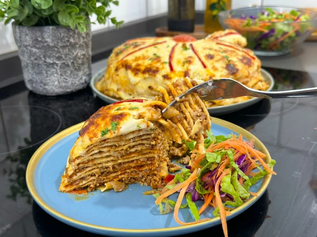 Palace Layer fake lasagna baked with crepes, beef filling, béchamel sauce, and melted cheese
