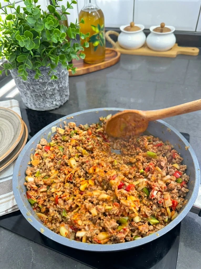 Ingredients for making Palace Layer recipe including crepes, beef, vegetables, and béchamel sauce