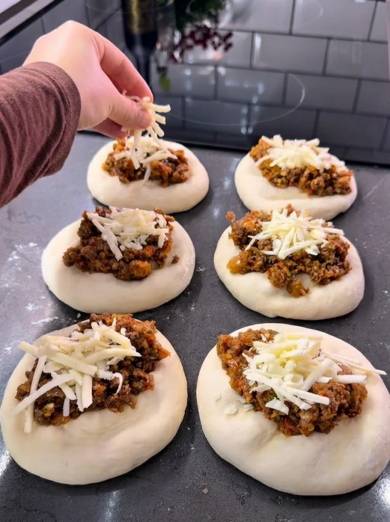 Flattened pita dough discs ready to be stuffed