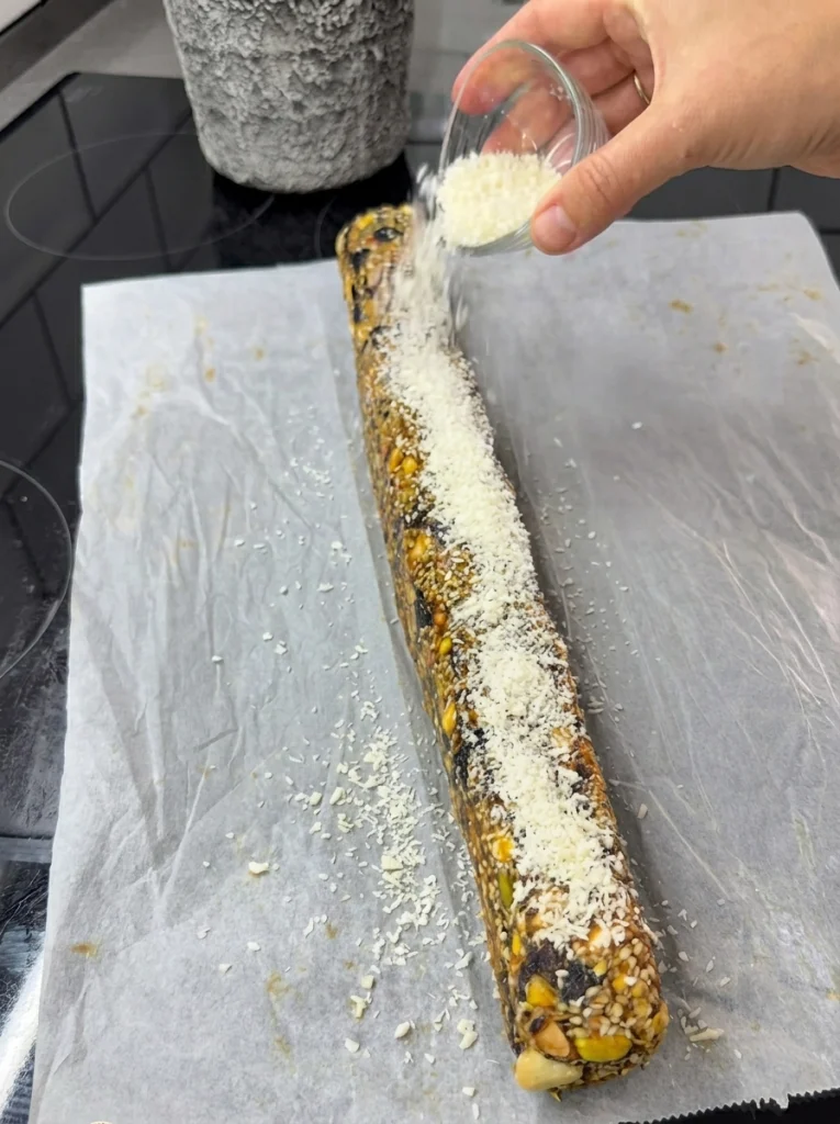 Shaping homemade date bar mixture on parchment paper