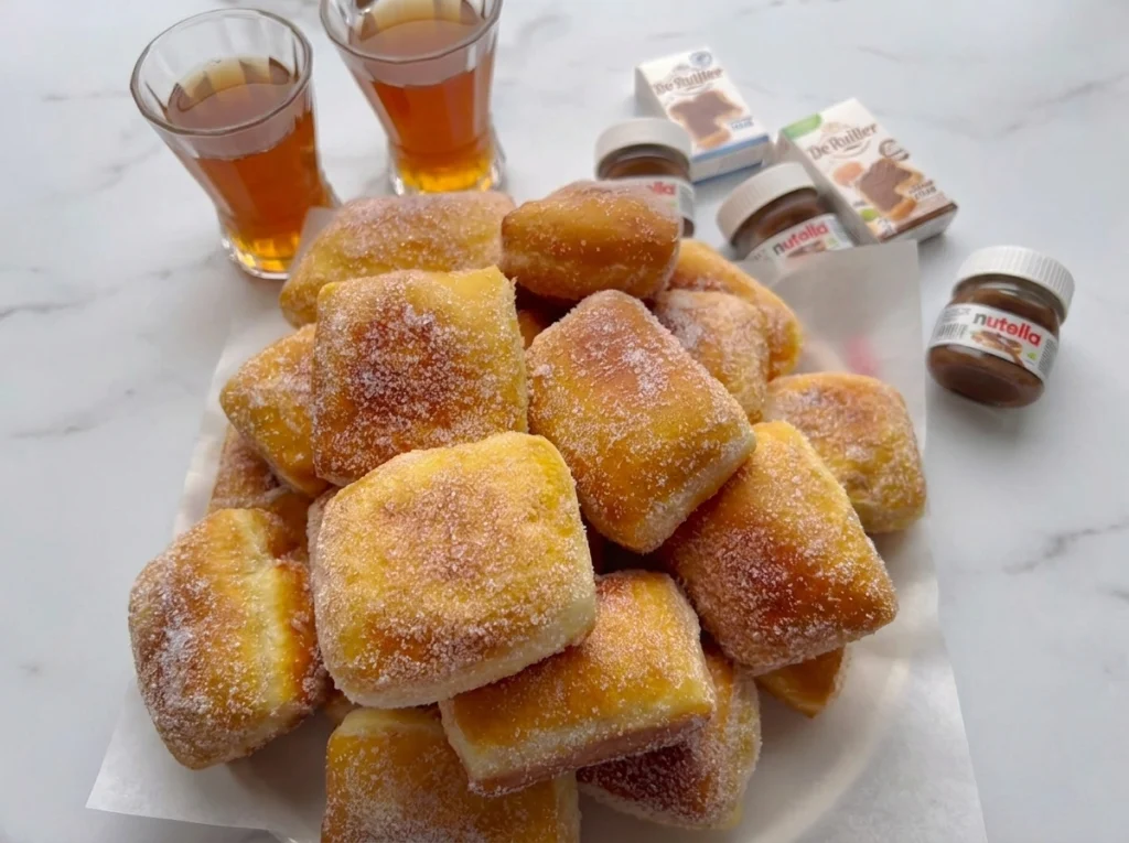 Soft and fluffy homemade vanilla donuts coated in sugar