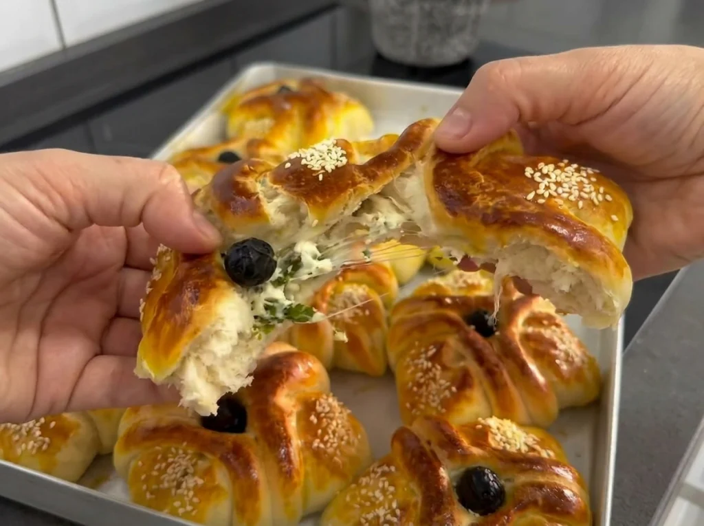 Soft and fluffy Turkish Böğçe pastries filled with cheese and baked until golden brown