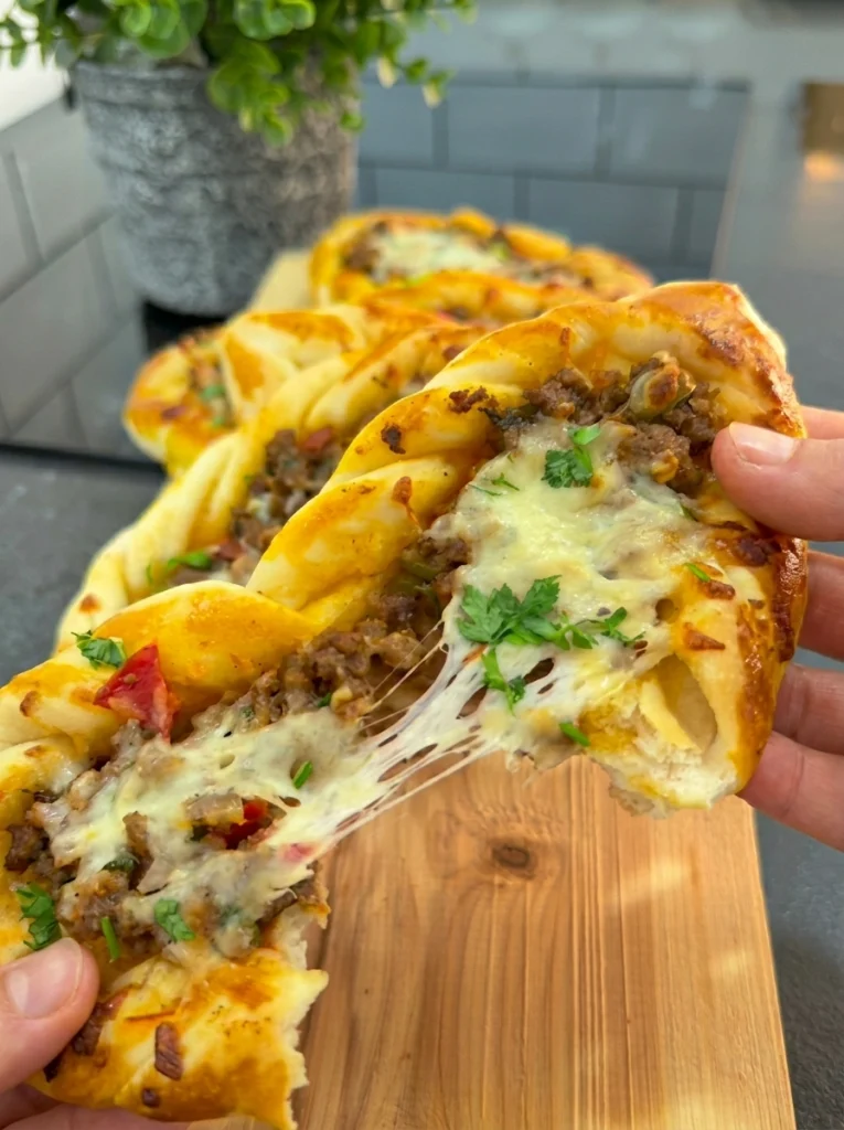 Homemade minced meat and kashar pide served warm with fresh salad on the side.
