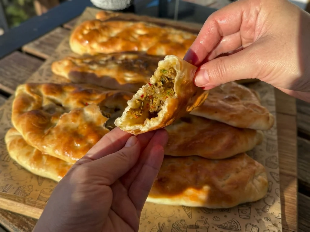 Homemade wild pides filled with seasoned ground beef and vegetables