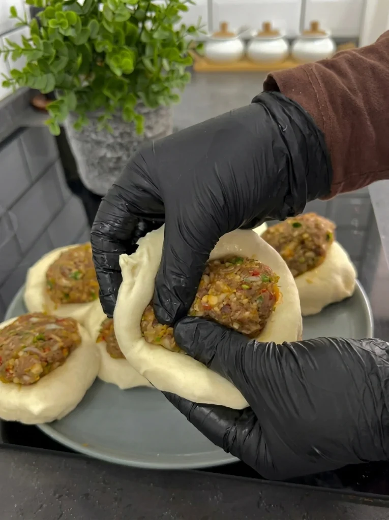Shaping traditional boat-shaped wild pides before baking