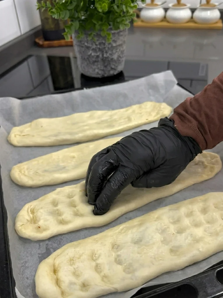 Unbaked wild pides arranged on a baking tray