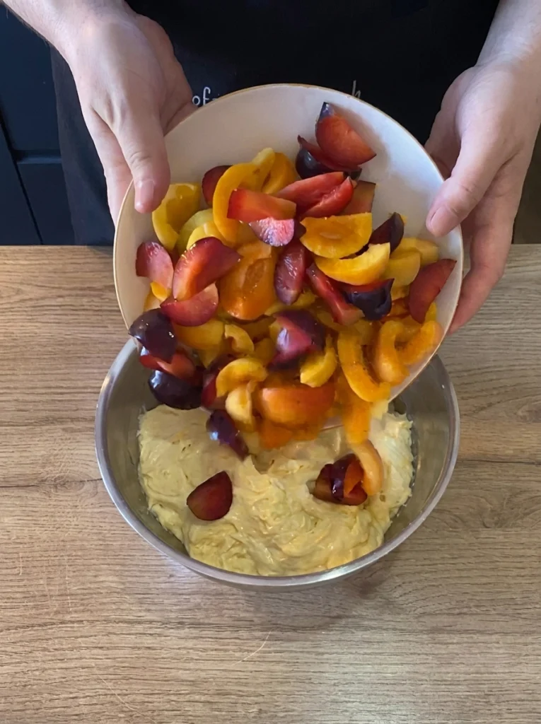 Soft apricot cake batter with yogurt in a mixing bowl