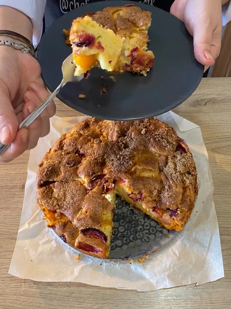 Close-up of moist apricot cake crumb with fruit pieces