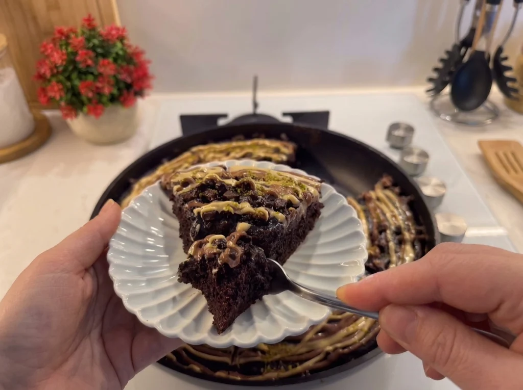 Banana chocolate cake drizzled with chocolate sauce