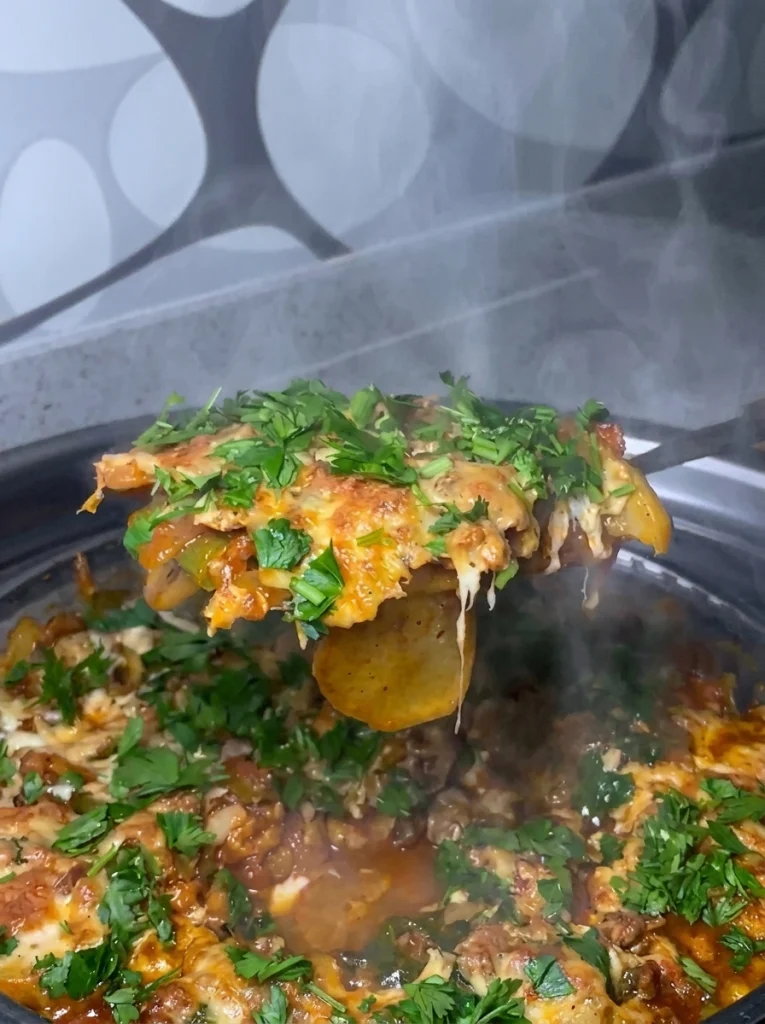 Beef and mushroom skillet served hot on a plate with fresh parsley