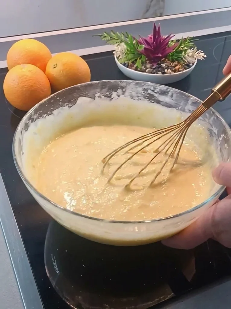 Whole orange blended into smooth cake batter