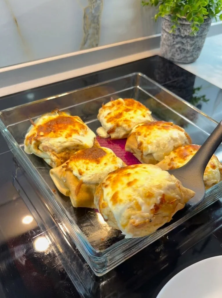 A serving of chicken crepe rolls plated and ready to eat