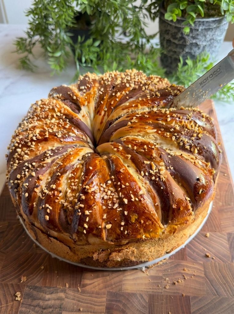 Close-up slice of chocolate roll bread showing cocoa swirl