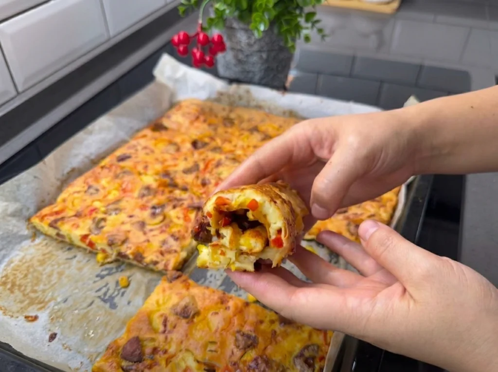 Crepe pizza recipe topped with cheese, peppers, and corn