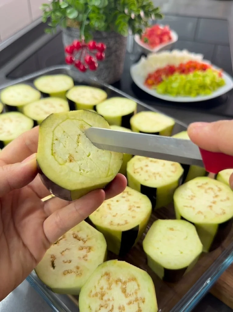 Roasted eggplants split open and ready to be stuffed