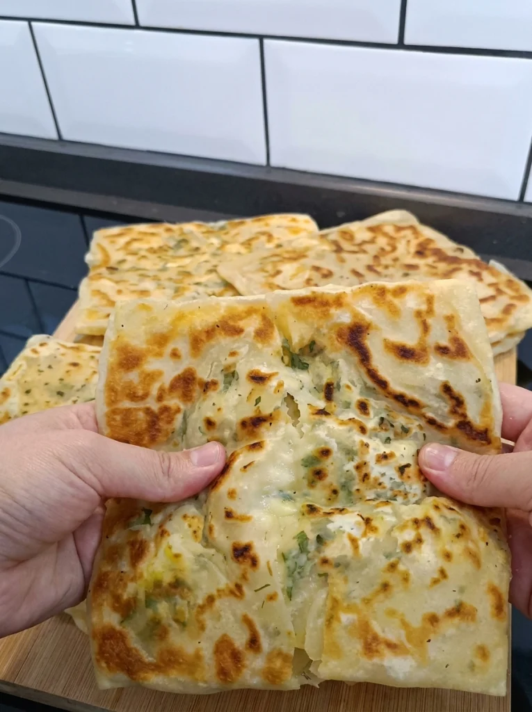 Moroccan crispy cheese flatbread served on a plate with tea