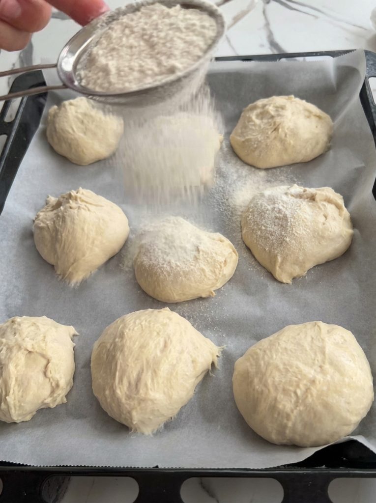 Unbaked spoon bread pieces sprinkled with flour on a tray