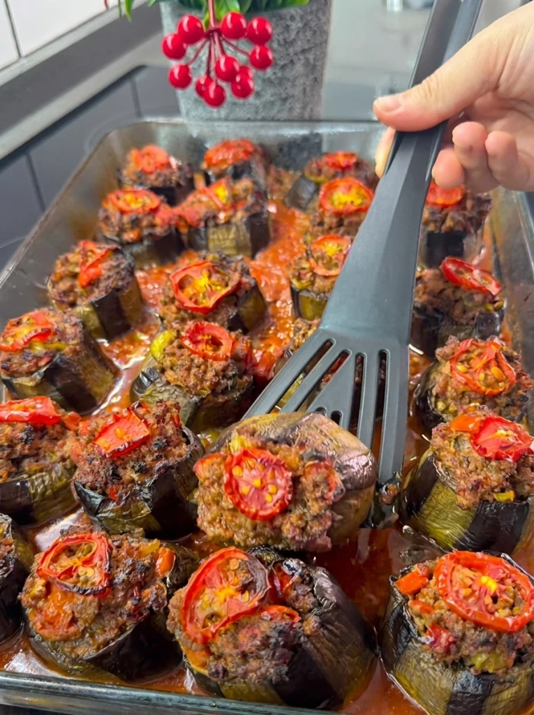 Turkish karnıyarık stuffed eggplant served on a plate
